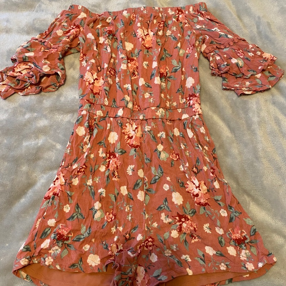 An off the shoulder romper